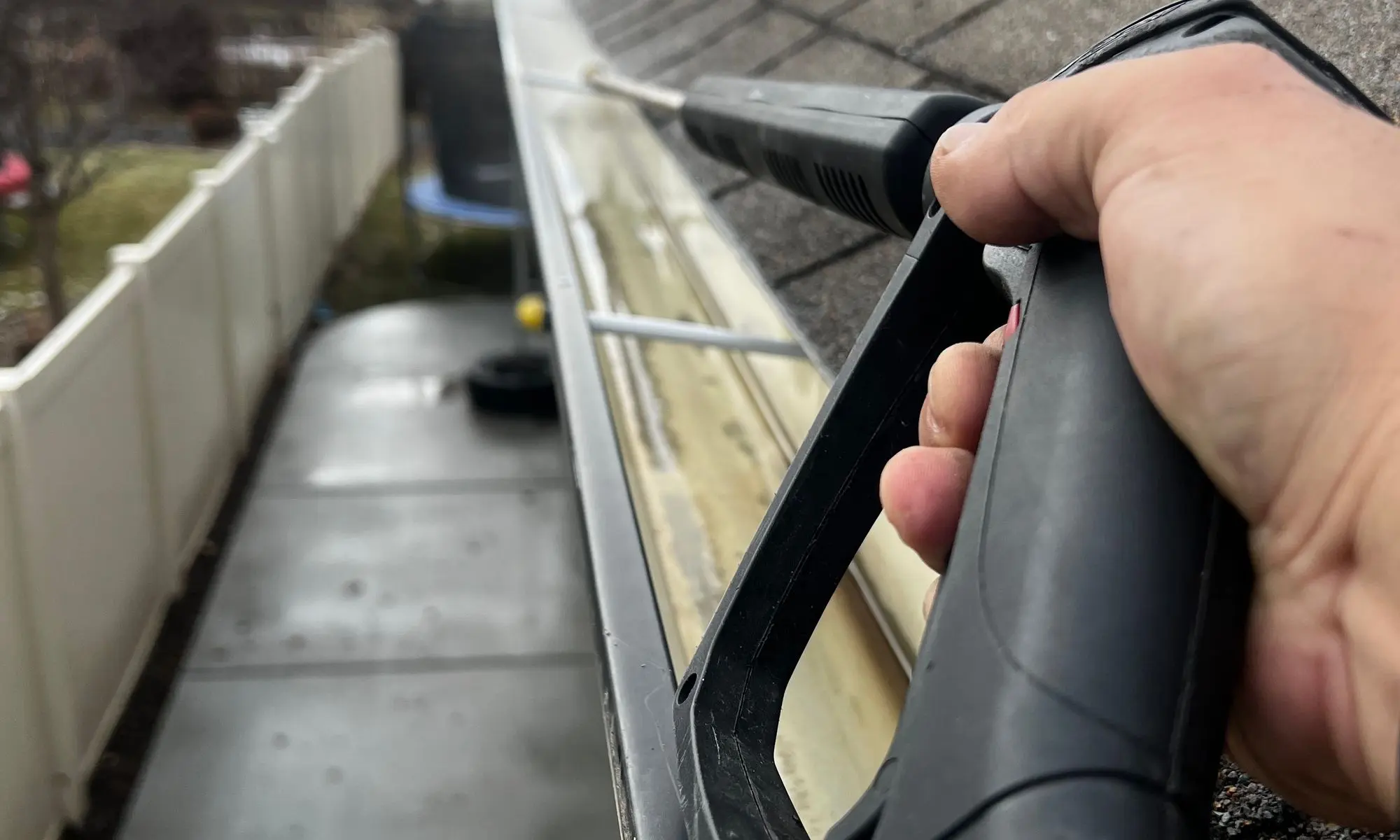 Residential gutter maintenance in progress